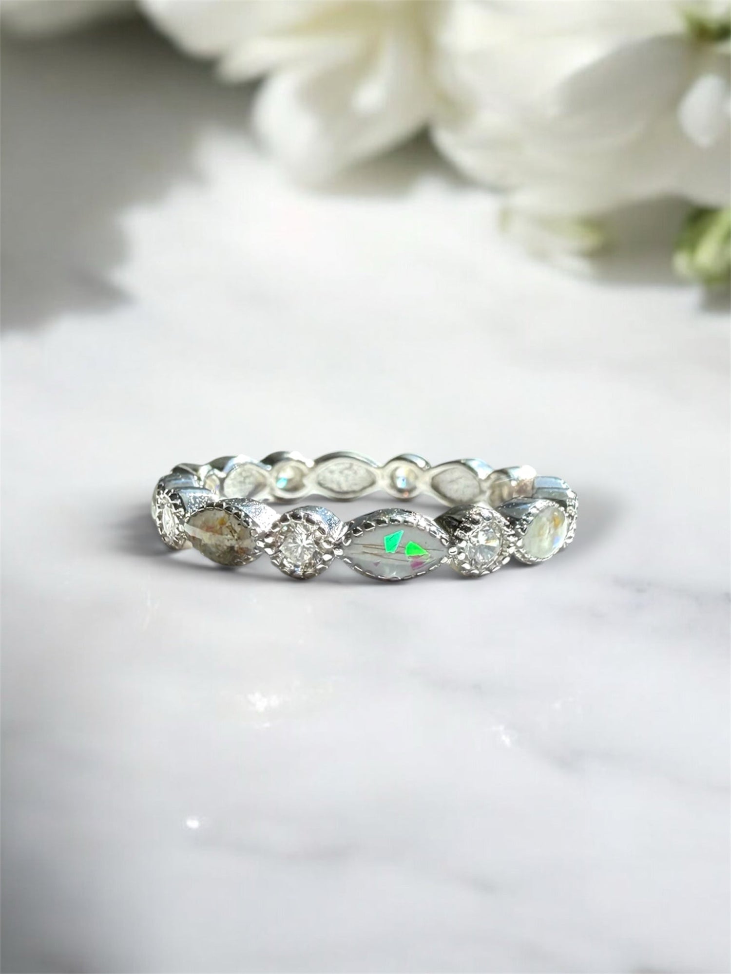 Sterling silver ring containing memorial ashes and hair. 