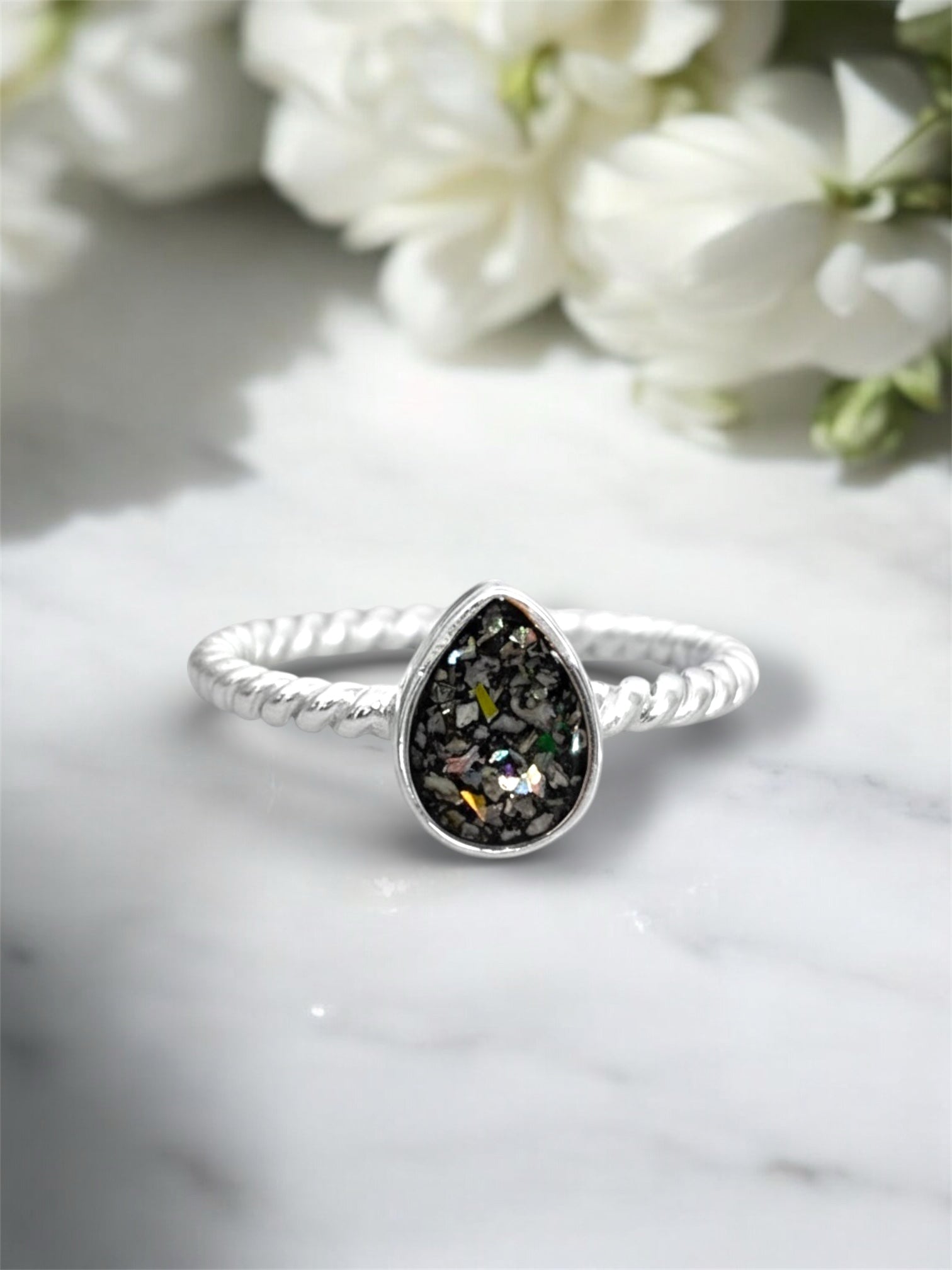 Sterling silver pear shaped ring made with ashes. 
