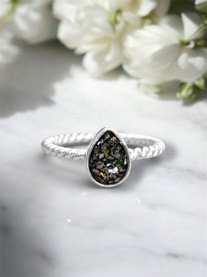 Sterling silver pear shaped ring made with ashes. 