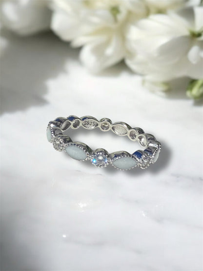 Preserved breastmilk keepsake ring in sterling silver with custom birthstones. 