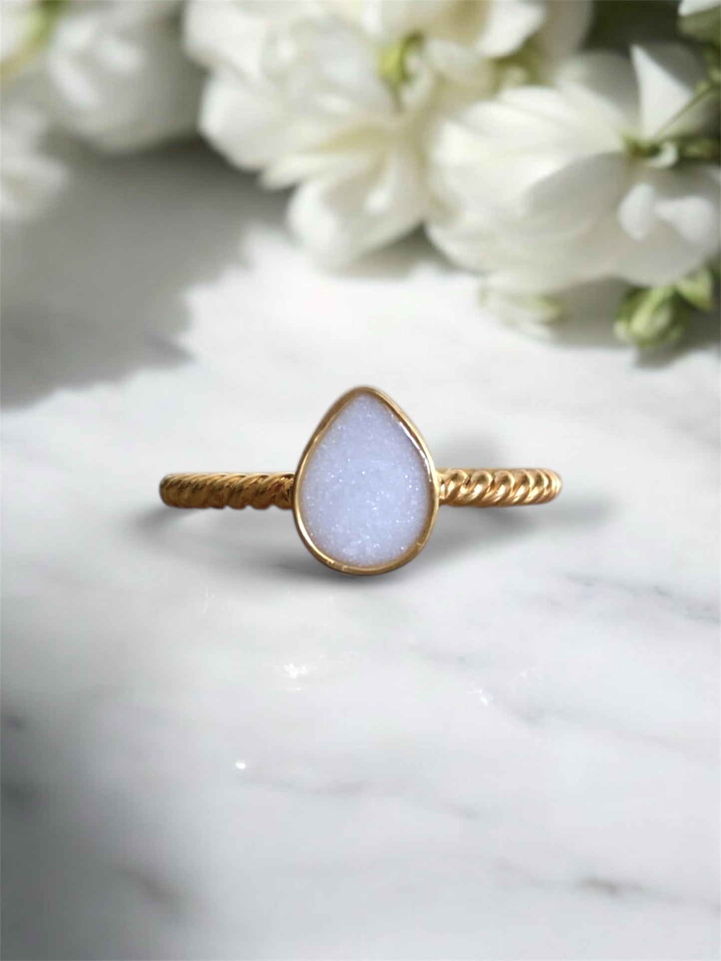 Sterling silver ring with preserved breastmilk. 
