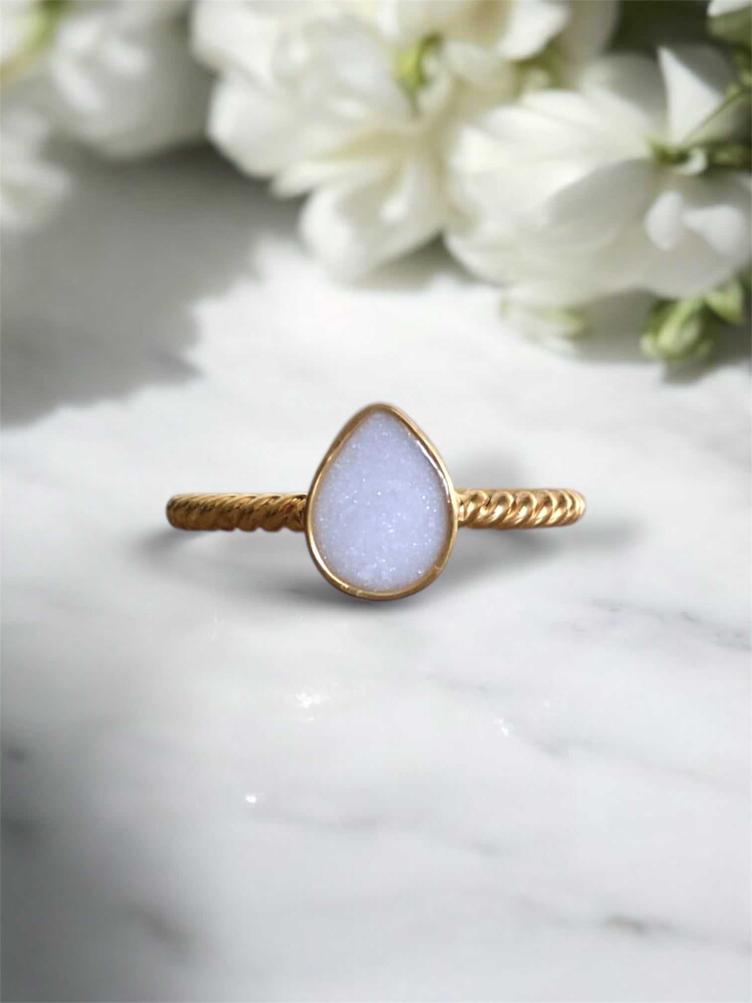 Sterling silver ring with preserved breastmilk. 