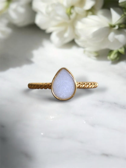 Sterling silver ring with preserved breastmilk. 