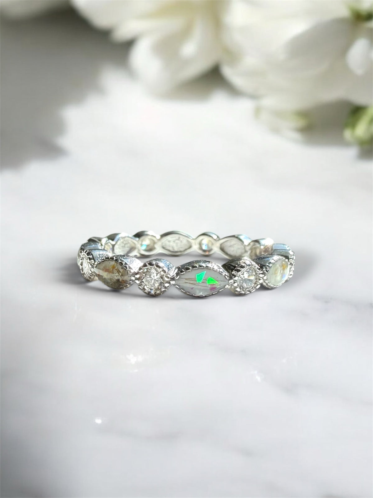 Sterling silver ring containing memorial ashes and hair. 