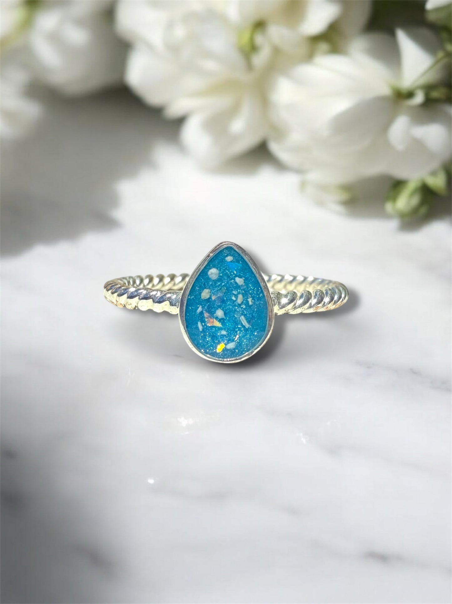 Sterling silver tear drop ring with cremation ashes. 