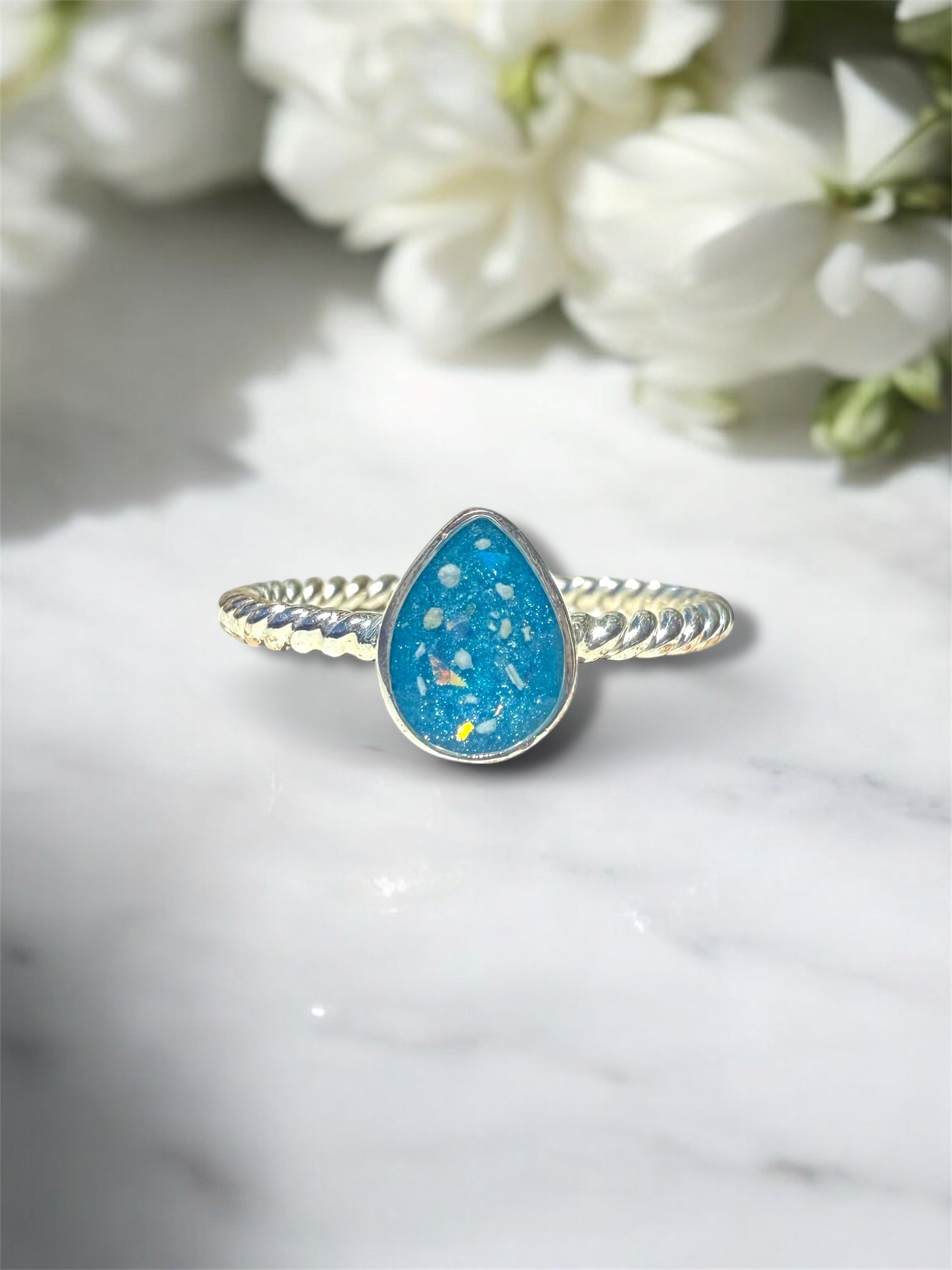 Sterling silver tear drop ring with cremation ashes. 