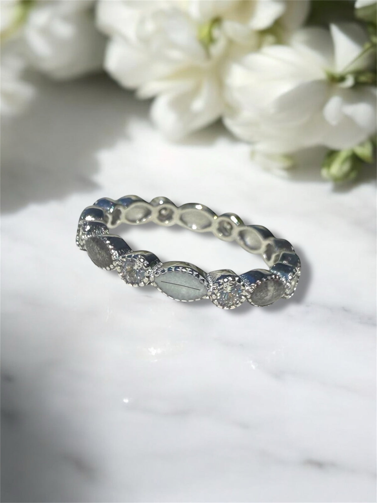 Cremation ashes keepsake ring with hair set in sterling silver. 
