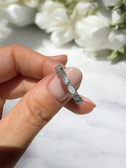 Ring containing ashes and hair in sterling silver with clear cubic zirconia gemstones.