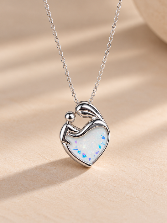 A mother and baby pendant encased with breastmilk. 