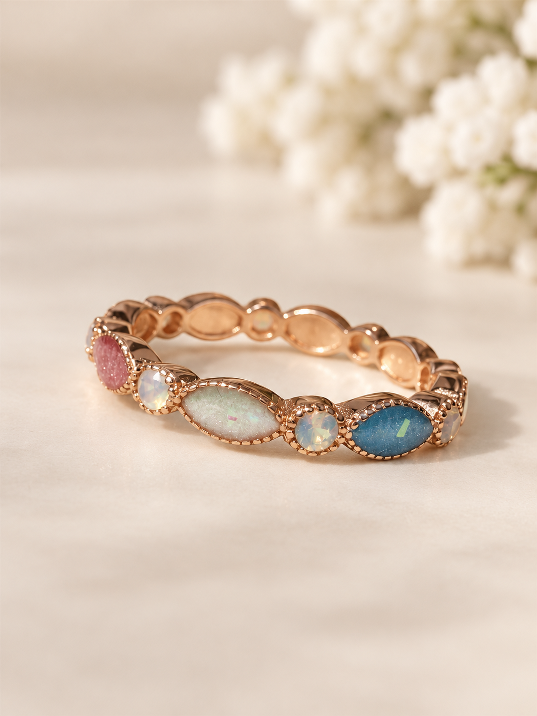 Breastmilk ring in rose gold customised with birthstones. 