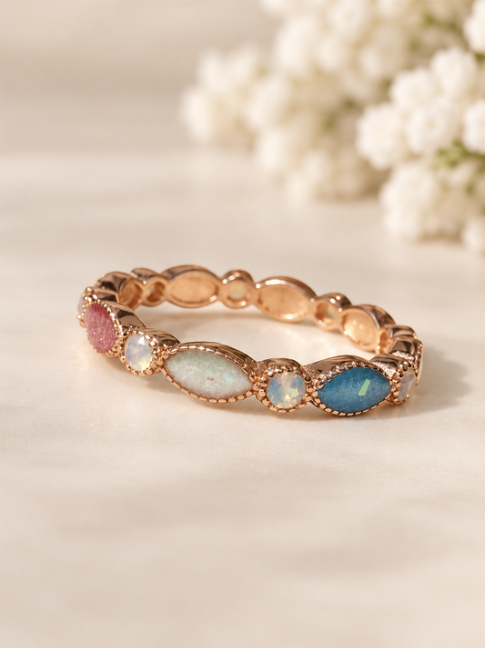 Breastmilk ring in rose gold customised with birthstones. 